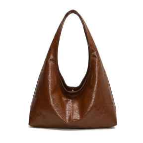 Sac hobo souple en cuir cognac Jeanne, vue de face sur fond blanc