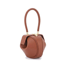 Sac boule en cuir cognac Faustine à anse ronde, vue de face sur fond blanc