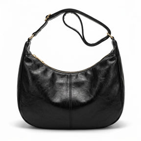 Sac hobo en cuir noir Colombe avec large sangle à boucle dorée, vue de face sur fond blanc