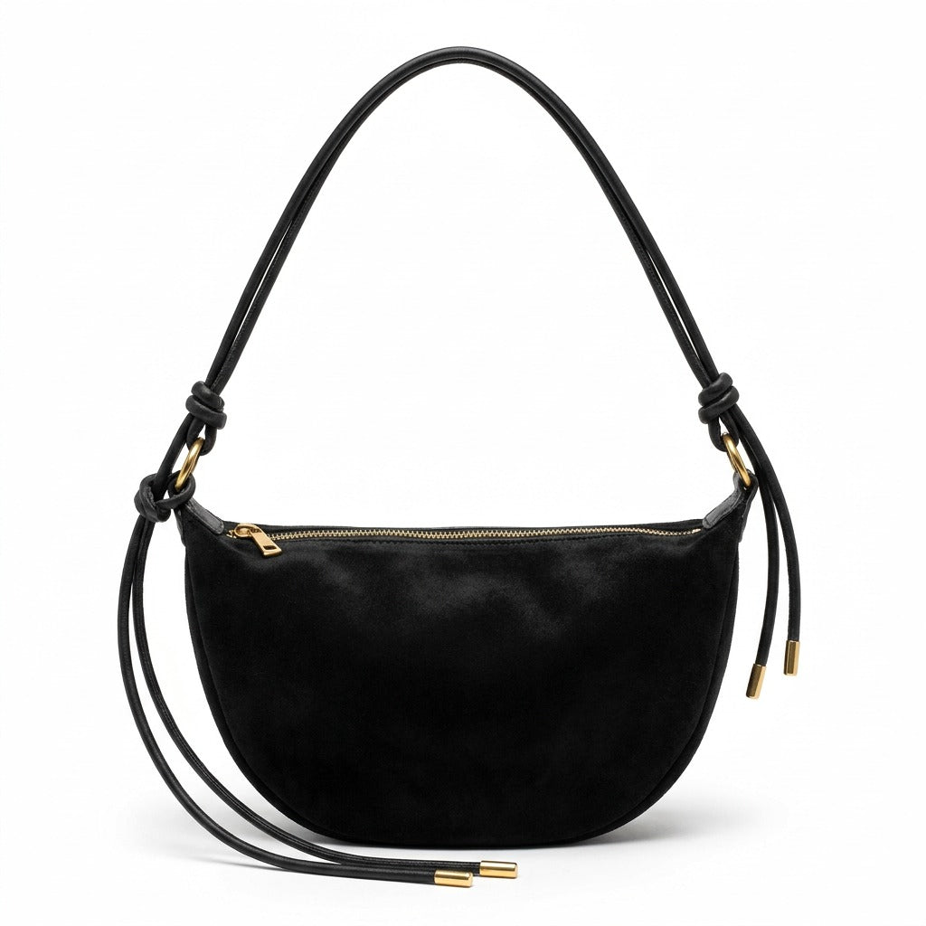 Sac croissant en cuir noir Héloïse avec anse nouée et anneaux dorés, vue de face sur fond blanc