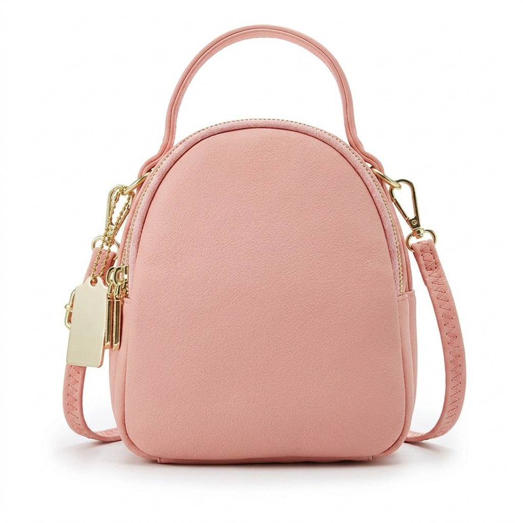 Mini sac à dos en cuir rose Philippine à trois fermetures dorées, vue de face sur fond blanc