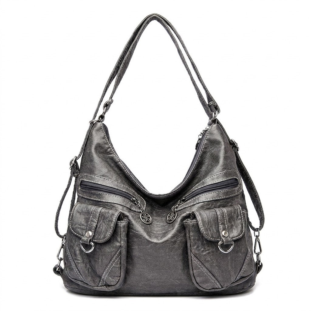 Sac à dos transformable en cuir gris Nine, vue de face sur fond blanc
