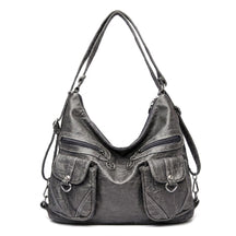 Sac à dos transformable en cuir gris Nine, vue de face sur fond blanc