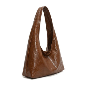 Sac hobo Jeanne cognac vu de trois quarts, profondeur et anse large