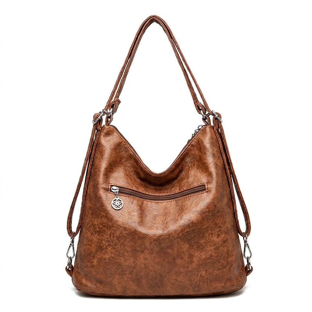 Dos du sac Nine cognac avec poche zippée et sangles à mousquetons
