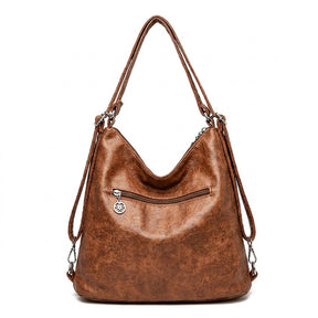Dos du sac Nine cognac avec poche zippée et sangles à mousquetons