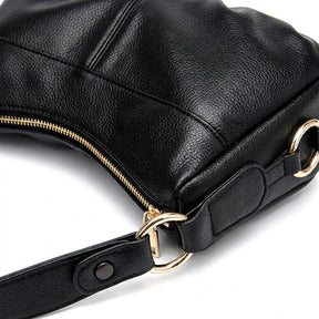 Détail des anneaux dorés, du zip et des coutures du sac à main Joséphine noir